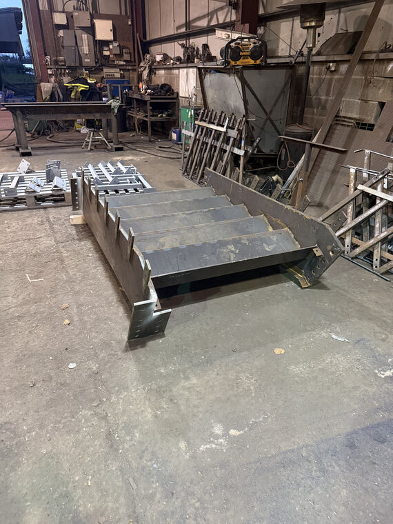 Fabricated box-section beam with mounting brackets