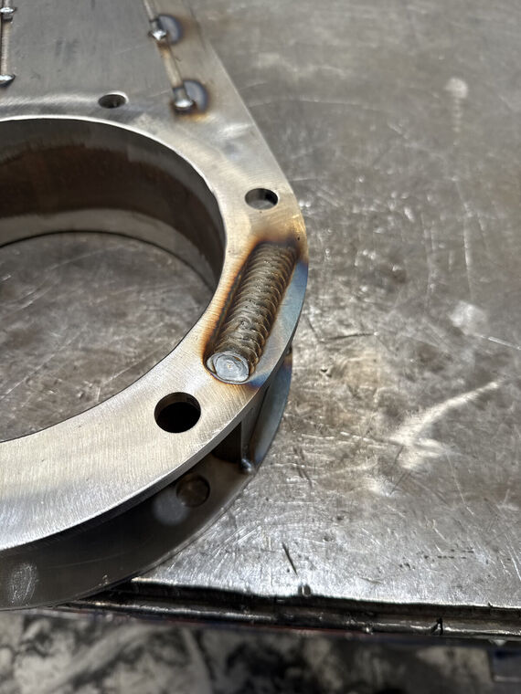 Close detail of threaded stud welded to flange ring