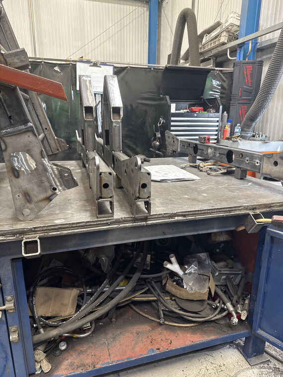 Fabricated steel brackets and bar stock, workshop